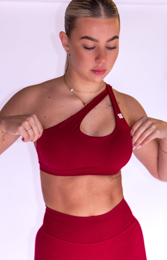 Pre-Order: SeamlessSculpt ™ Asymmetric Sports Bra in Cherry Red